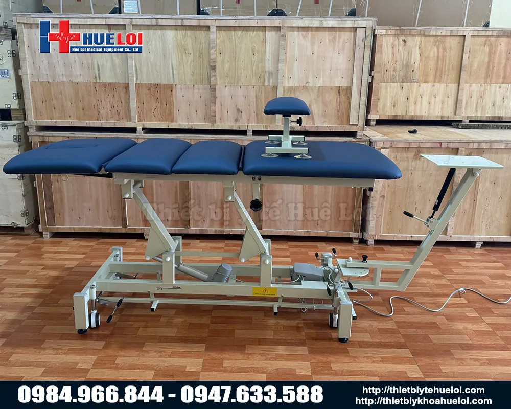 Máy kéo giãn cột sống lưng và cổ nâng hạ bằng điện